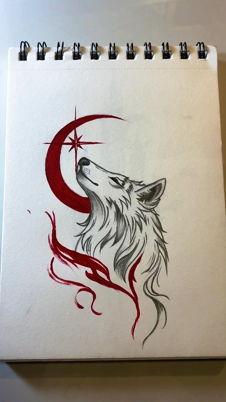 Wolf howling at a red crescent moon drawing in a spiral sketchbook