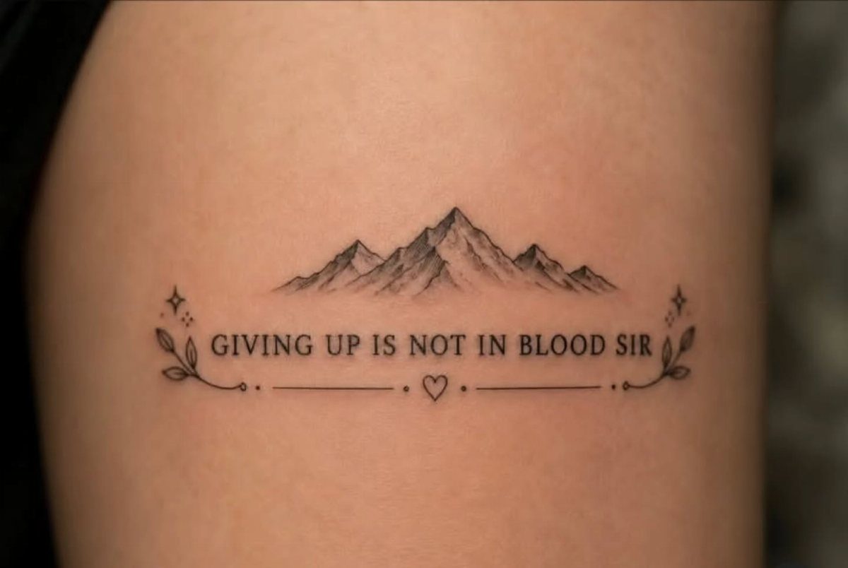 Mountain range tattoo with the strength quote Giving up is not in blood sir