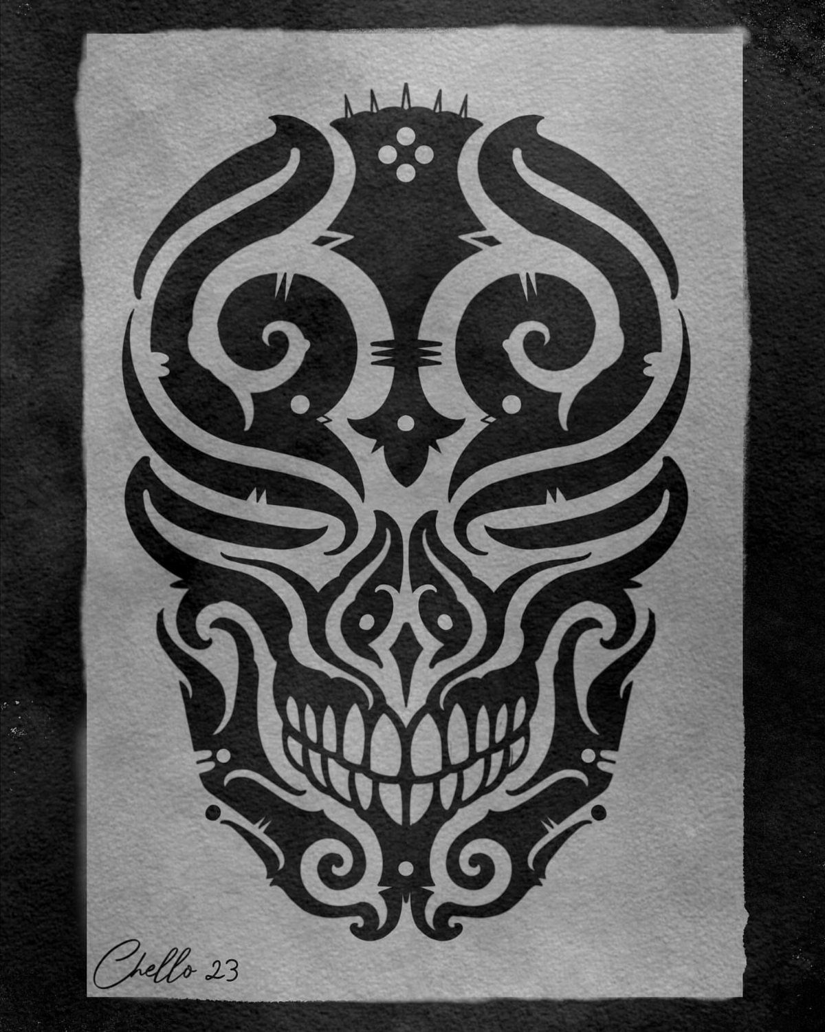 Stylized skull silhouette drawn in black ink with ornate swirls on grey paper.