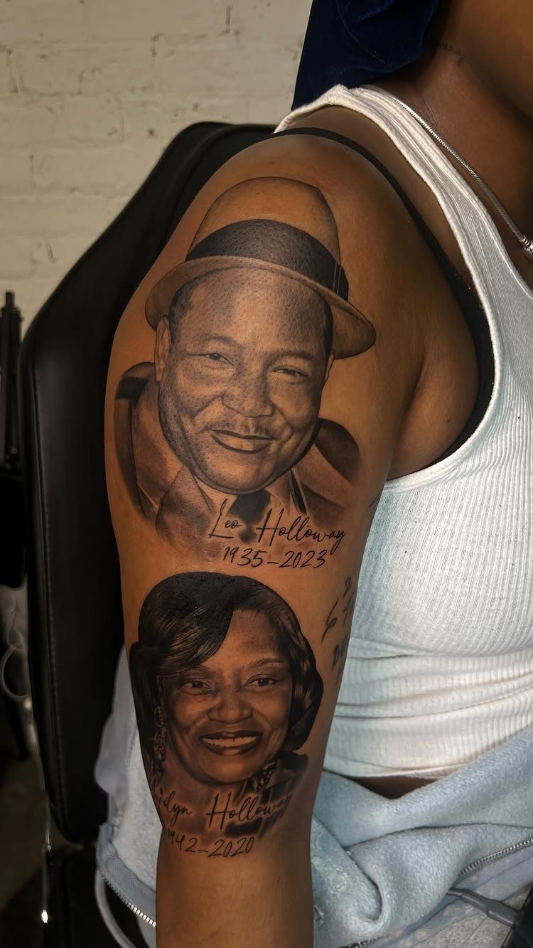 Two realistic black and grey portrait tattoos of a man and woman on an arm.