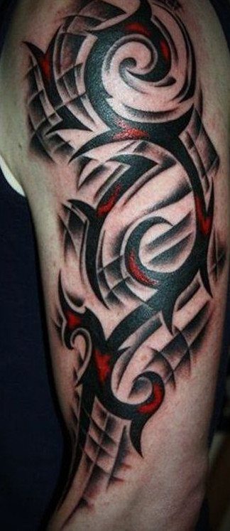 Tribal tattoo on an arm with bold black swirls and red accents.
