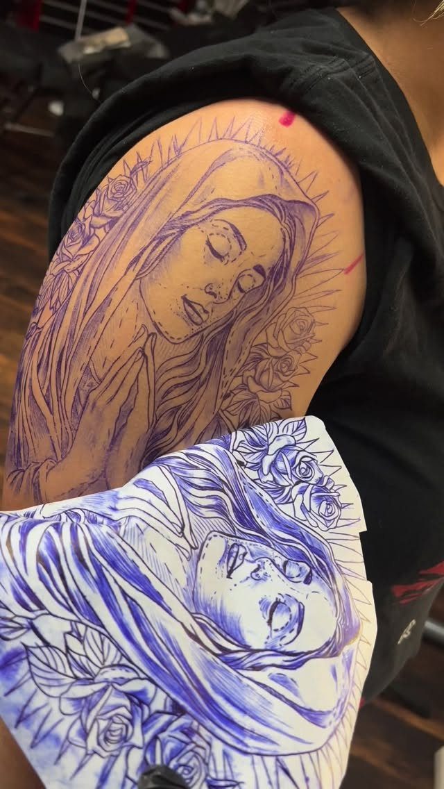 Tattoo stencil of a veiled woman applied to an arm with paper design.