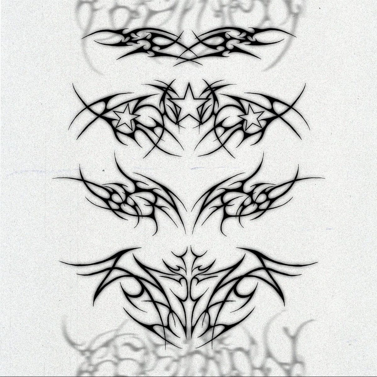 Tribal tattoo designs with integrated stars drawn in black ink on white paper