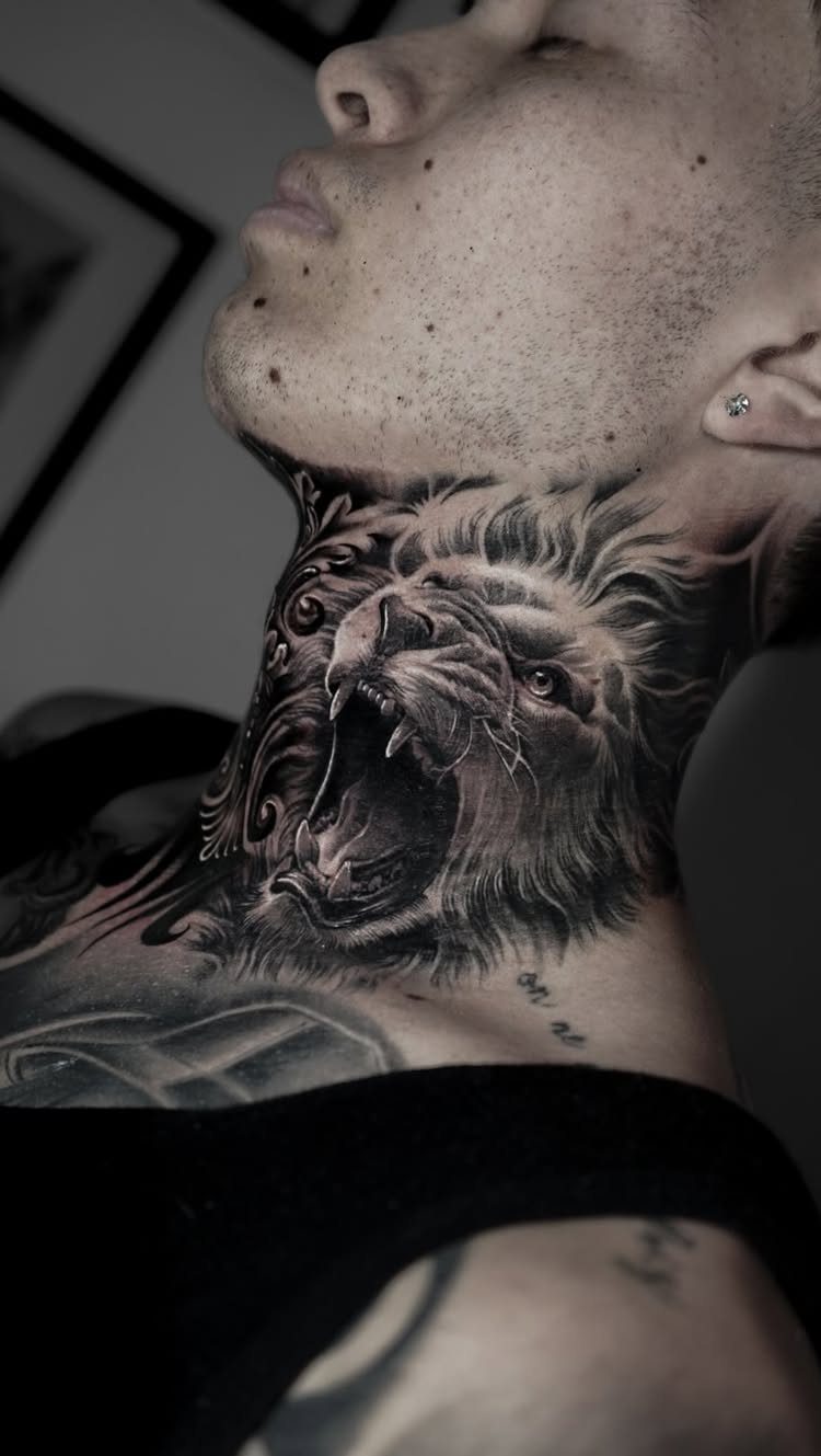 Roaring lion tattoo covering the side and front of a person's neck.